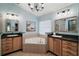 Bright bathroom with separate vanities, tub, and ample natural light at 3130 Bulkley Pl, Eustis, FL 32726