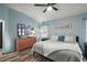 Serene bedroom with a ceiling fan, neutral colors and wood flooring at 3130 Bulkley Pl, Eustis, FL 32726