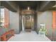 Inviting front entrance with a decorative door, charming welcome decor, and comfortable bench at 3130 Bulkley Pl, Eustis, FL 32726
