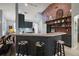 Stylish kitchen bar area with seating, modern lighting, and an open layout at 3130 Bulkley Pl, Eustis, FL 32726
