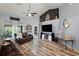 Comfortable living space showcasing wood flooring, high ceilings, and backyard access at 3130 Bulkley Pl, Eustis, FL 32726