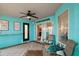 Enclosed patio with ceiling fan, chairs, and view of the backyard at 3130 Bulkley Pl, Eustis, FL 32726