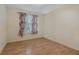 Bedroom features a floral curtain and tiled flooring at 3368 Parkchester Square Blvd # 104, Orlando, FL 32835