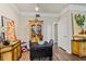 Dining area with black table, hardwood floors, and a view of the kitchen at 3368 Parkchester Square Blvd # 104, Orlando, FL 32835