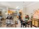 Open floor plan with barstool seating separating the dining area and the kitchen at 3368 Parkchester Square Blvd # 104, Orlando, FL 32835