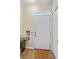 Inviting entryway with a white front door, transom window, and wood-look flooring at 3368 Parkchester Square Blvd # 104, Orlando, FL 32835