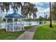 Charming gazebo by the lake, providing a serene spot to relax and enjoy the view at 3368 Parkchester Square Blvd # 104, Orlando, FL 32835