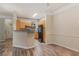 Bright kitchen and dining area with wooden cabinets, a breakfast bar, and modern appliances at 3368 Parkchester Square Blvd # 104, Orlando, FL 32835