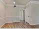 Bright and airy living space with neutral walls, wood-look flooring, and white trim at 3368 Parkchester Square Blvd # 104, Orlando, FL 32835