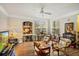 Inviting living room with a window, hardwood floors, and an archway at 3368 Parkchester Square Blvd # 104, Orlando, FL 32835