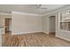Open living room with hardwood floors, natural light, and neutral paint at 3368 Parkchester Square Blvd # 104, Orlando, FL 32835