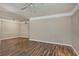 Spacious living room featuring wood-look flooring and neutral paint, perfect for customizing at 3368 Parkchester Square Blvd # 104, Orlando, FL 32835