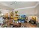 Bright living room featuring wood-look floors and an open layout with a kitchen view at 3368 Parkchester Square Blvd # 104, Orlando, FL 32835