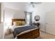 Comfortable bedroom with wooden bed, bedside table, neutral decor, and soft, natural light; relaxing retreat at 3390 Melissa Ln, The Villages, FL 32163