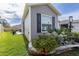 Close up of beautiful landscaping including stone borders and lush green lawn at 3390 Melissa Ln, The Villages, FL 32163