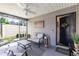 Covered porch featuring comfortable outdoor seating and a ceiling fan at 3390 Melissa Ln, The Villages, FL 32163