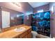 Bathroom featuring a vanity and mirror and a shower with blue floral curtain at 384 Coral Beach Cir, Casselberry, FL 32707