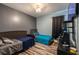 Bedroom with two beds and gray accent wall, stylish wood-look flooring at 384 Coral Beach Cir, Casselberry, FL 32707