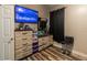 Bedroom featuring a TV, dresser, and stylish wood-look flooring at 384 Coral Beach Cir, Casselberry, FL 32707