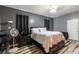 Bedroom featuring a bed, dresser, fan, and stylish wood-look flooring at 384 Coral Beach Cir, Casselberry, FL 32707