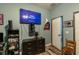 Bedroom featuring a large TV and wood-look flooring at 384 Coral Beach Cir, Casselberry, FL 32707