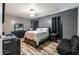 Bedroom featuring a bed, dresser, and stylish wood-look flooring at 384 Coral Beach Cir, Casselberry, FL 32707