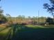 Lush backyard featuring a serene lake and trailer with a boat at 43648 S Island Dr, Paisley, FL 32767