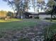 Expansive backyard featuring a covered parking area and ample open space at 43648 S Island Dr, Paisley, FL 32767