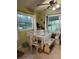 Bright dining area with built-in bench seating and a view of the backyard through the windows at 43648 S Island Dr, Paisley, FL 32767