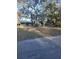 Lovely home with mature trees and a charming playhouse in the yard at 43648 S Island Dr, Paisley, FL 32767