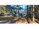 Charming single-story home nestled amongst mature trees with an attached carport on a spacious lot at 43648 S Island Dr, Paisley, FL 32767
