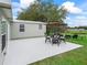 Patio with furnishings and a view of the yard and golf course at 511 Bonita Dr, Lady Lake, FL 32159