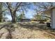 Expansive backyard with mature trees providing ample shade at 6213 Highland Ave, Leesburg, FL 34748