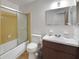 Functional bathroom with vanity, shower with glass doors, and toilet at 6213 Highland Ave, Leesburg, FL 34748