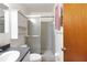 Bathroom with a step in shower, updated cabinet and mirror at 6213 Highland Ave, Leesburg, FL 34748