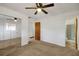 Bedroom with carpet, mirrored closet, and bathroom access at 6213 Highland Ave, Leesburg, FL 34748