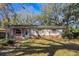 Charming single-story home with brick accents and well-maintained landscaping at 6213 Highland Ave, Leesburg, FL 34748