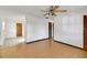 Open living room with wood laminate flooring and abundant natural light at 6213 Highland Ave, Leesburg, FL 34748