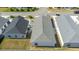 Real estate aerial view showing a gray roof and backyard at 7163 Jerry Ave, The Villages, FL 34762