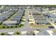 An aerial view shows a vibrant neighborhood with neatly arranged homes and well-maintained landscaping at 7163 Jerry Ave, The Villages, FL 34762