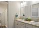 Clean bathroom featuring a double vanity with modern fixtures and a separate toilet and shower area at 7163 Jerry Ave, The Villages, FL 34762