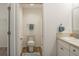 Compact bathroom with a toilet, shower, and vanity at 7163 Jerry Ave, The Villages, FL 34762
