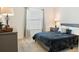 Comfortable bedroom with a soft bed, bedside table with lamp, and a bright window at 7163 Jerry Ave, The Villages, FL 34762
