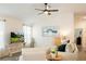 Inviting living room with ample natural light, modern decor, and a comfortable seating arrangement at 7163 Jerry Ave, The Villages, FL 34762