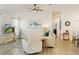 Inviting living room with ample natural light, modern decor, and a comfortable seating arrangement at 7163 Jerry Ave, The Villages, FL 34762