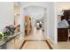 Inviting foyer with tile flooring and decorative lighting leading to open living spaces at 8780 Bridgeport Bay Cir, Mount Dora, FL 32757