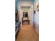 Inviting foyer with tile flooring, decorative mirror, console table, and arched entryway creating a warm welcome to the home at 8780 Bridgeport Bay Cir, Mount Dora, FL 32757