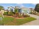 Single Gathering home boasting vibrant landscaping and a spacious two car garage at 8780 Bridgeport Bay Cir, Mount Dora, FL 32757