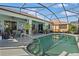 Back yard pool with covered lanai featuring multiple seating areas at 8780 Bridgeport Bay Cir, Mount Dora, FL 32757