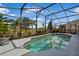 A screened-in pool offers a private oasis with beautiful lake views at 8780 Bridgeport Bay Cir, Mount Dora, FL 32757
